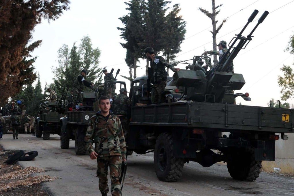 Syrian army units and pro-government forces deploying at an undisclosed location in western Syria. Photo: AFP
