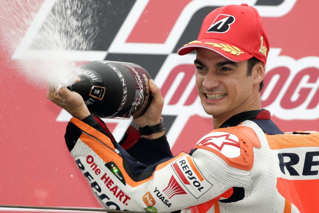 Spanish MotoGP rider Dani Pedrosa celebrates after winning the Japanese Grand Prix at the Motegi circuit. Photo: EPA