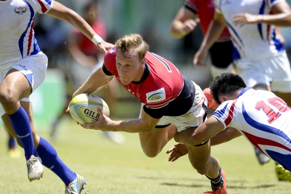 Tom McQueen dives in to score a try against Taiwan in the Sri Lanka Sevens Cup quarter-finals on Sunday. Photos: Thusith Wijedoru for Asia Rugby
