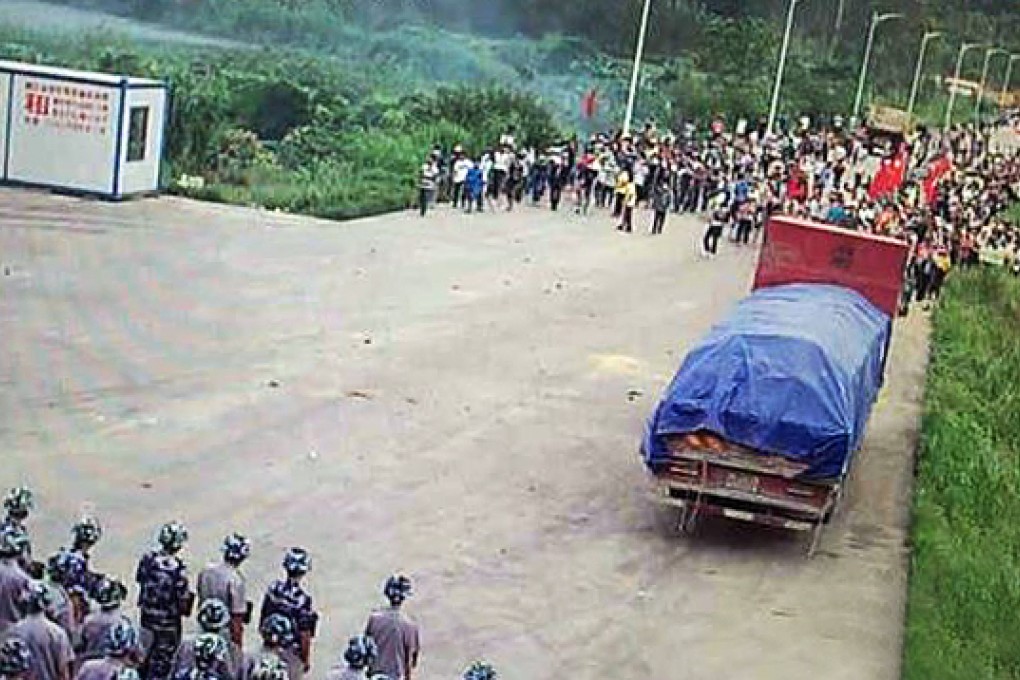 Photos posted on social media purportedly show villagers facing off against the police over plans for an incinerator in Chunwan town in Guangdong. Photo: SCMP Pictures