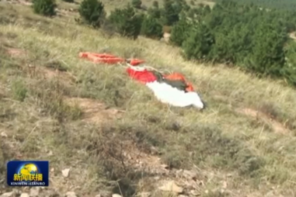 The pilot's parachute at the crash site. Photo: CCTV