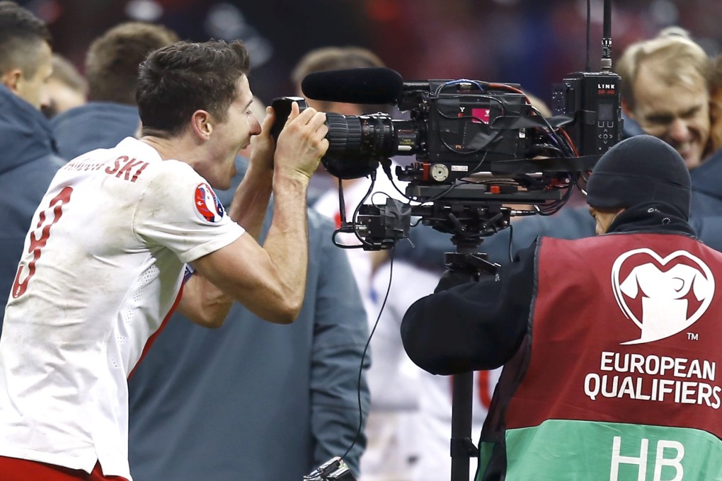 Lewandowski shouts into a camera. Photo: Reuters