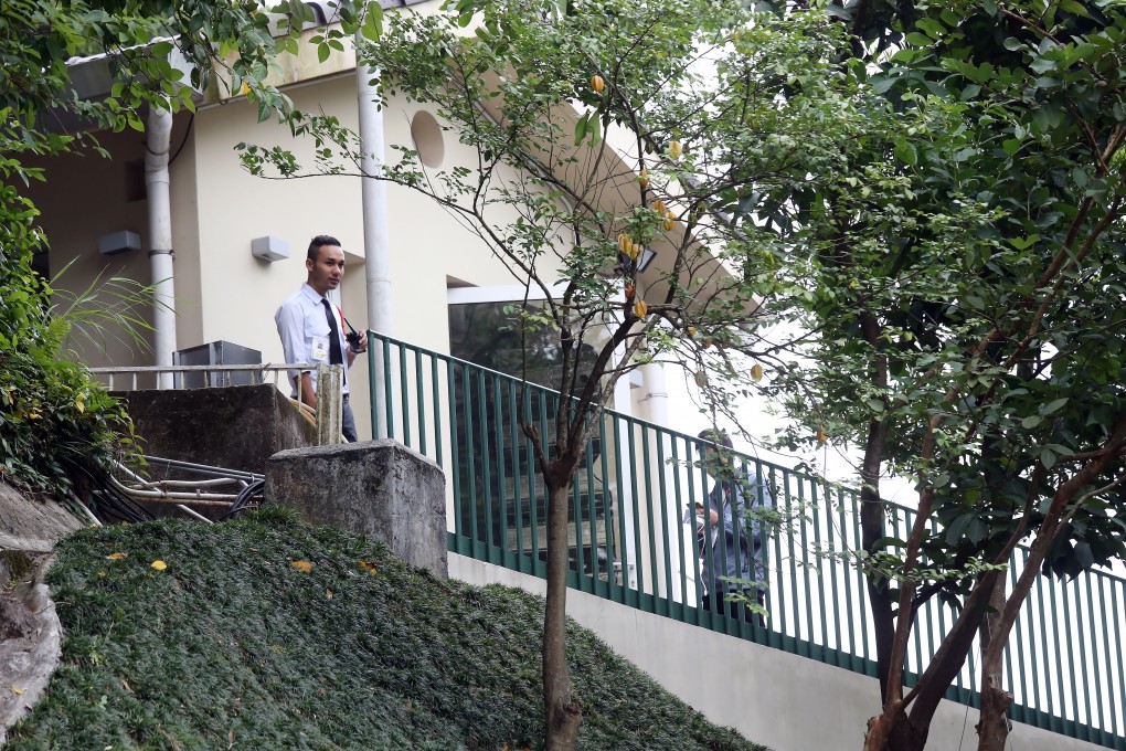 Police investigate on Monday after burglars took watches and jewellery worth a reported HK$2.45 million from HSBC Asia-Pacific chief Peter Wong Tung-shun's luxury home on The Peak. Photo: Dickson Lee