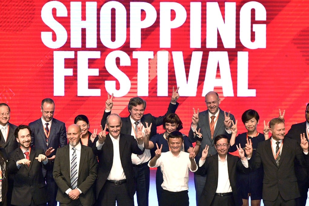 Alibaba Group's president Michael Evans, executive chairman Jack Ma and CEO Daniel Zhang (front row centre, left to right) are pictured during the launch event of Alibaba's Tmall 11.11 Global Shopping Festival, at the company's headquarters in Hangzhou, Zhejiang province on Tuesday. Photo: Reuters