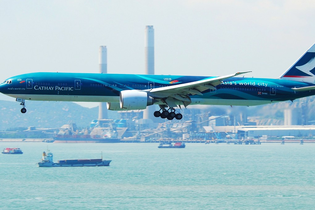 A Cathay Pacific Boeing 777-300ER is shown landing at Hong Kong International Airport in this file photo. Cathay stopped flying over the danger zone last Thursday. Photo: SCMP Pictures