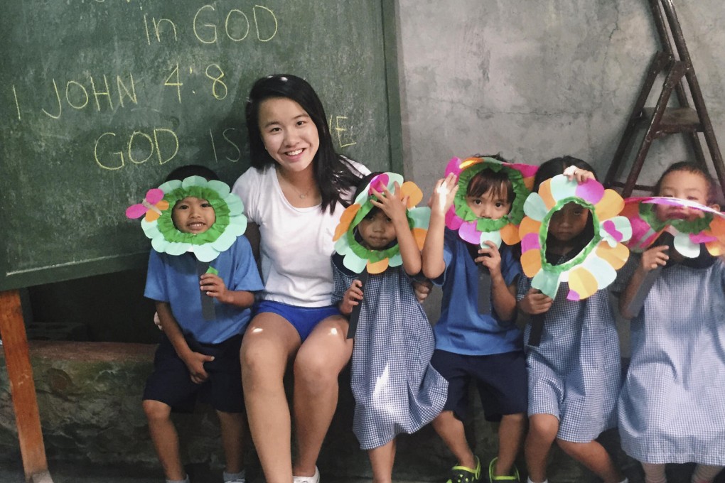 Experienced student volunteer Imogen Yih with children in the city of Dumaguete, in the Philippine province of Negros Oriental.