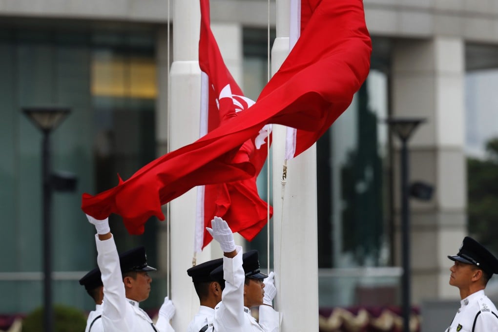 A flag-raising ceremony being held as part of celebrations in Hong Kong to mark National Day this year. Photo: AP