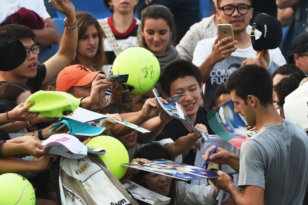 Novak Djokovic signs autographs for some of his many Chinese fans. Photo: