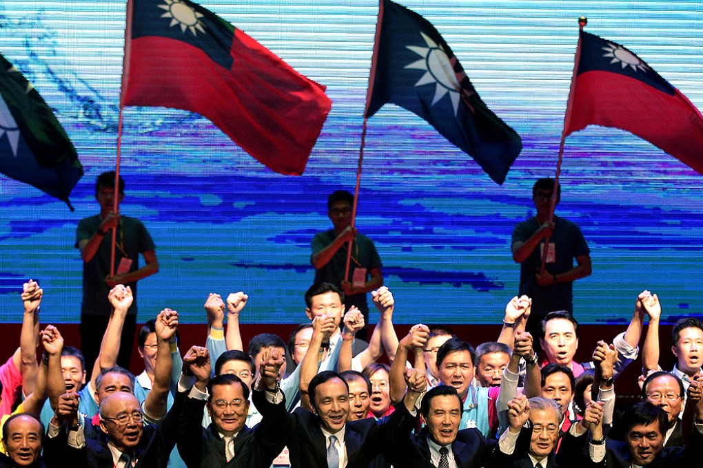 Taiwan's ruling Nationalist Kuomintang Party (KMT) chairman and presidential candidate Eric Chu (middle) celebrates at a party congress in Taipei after the announcement. Photo: Reuters