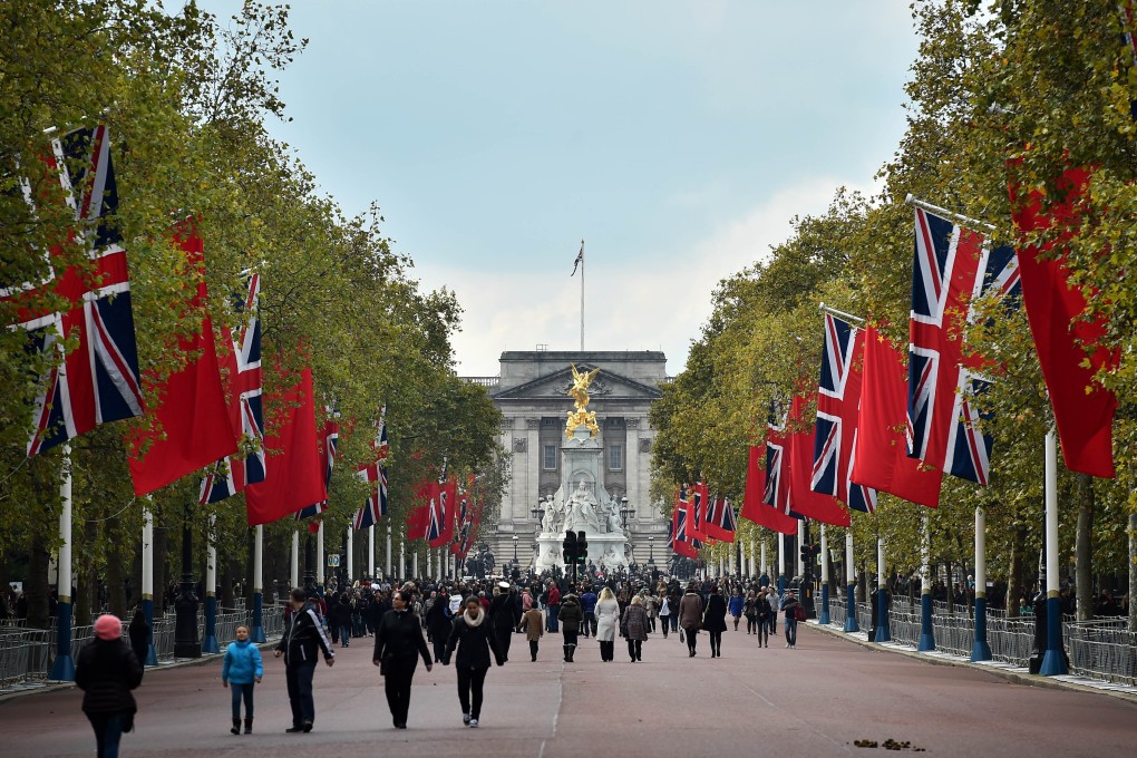 British Union flags and Chinese flags fly together on the Mall in central London ahead of a state visit by President Xi Jinping. Photo: AFP