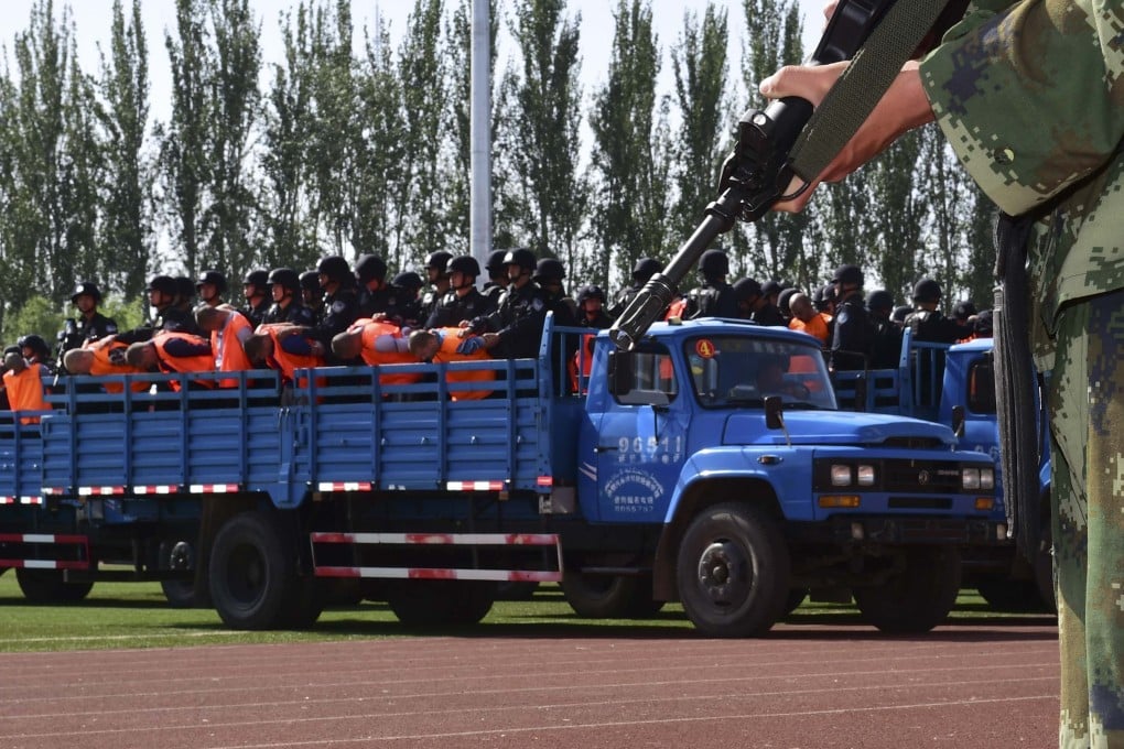 Criminals and terrorism suspects are transported to a stadium for a mass sentencing rally in Yili, Xinjiang Uighur Autonomous Region, in 2014. Photo: Reuters