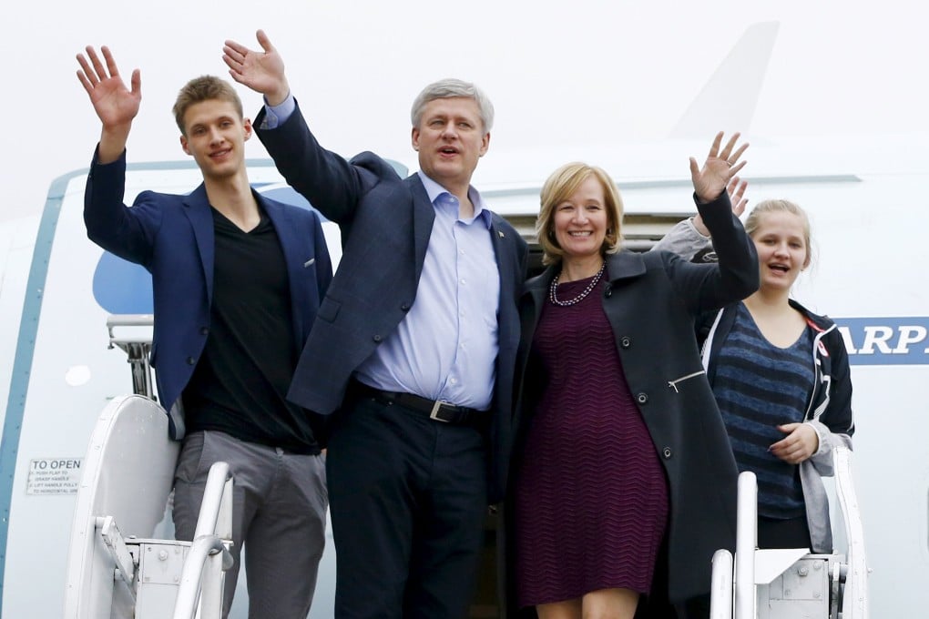 End of an era?  Canada's Prime Minister and Conservative leader Stephen Harper gets off his campaign plane with his wife Laureen, son Benjamin and daughter Rachel in Abbotsford, British Columbia. Photo: Reuters