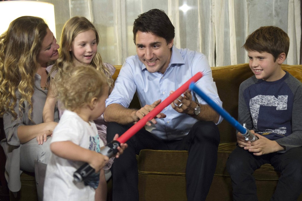 Justin Trudeau with his family while watching the results. Photo: Reuters