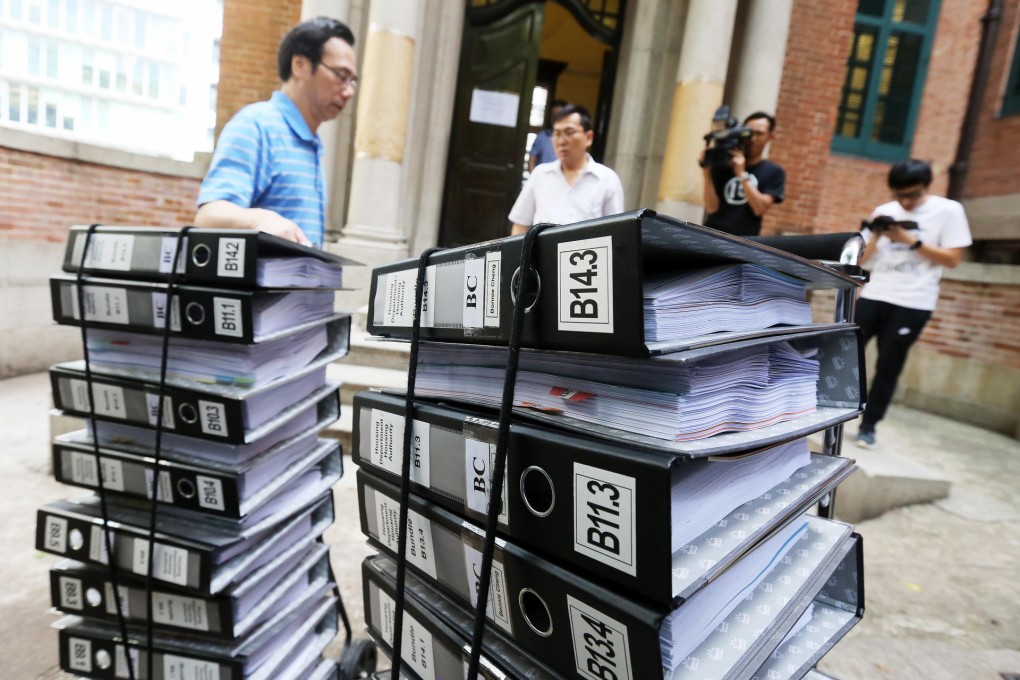 Documents are brought in for the commission investigation being held at the Former French Mission Building in Central.Photo: Dickson Lee