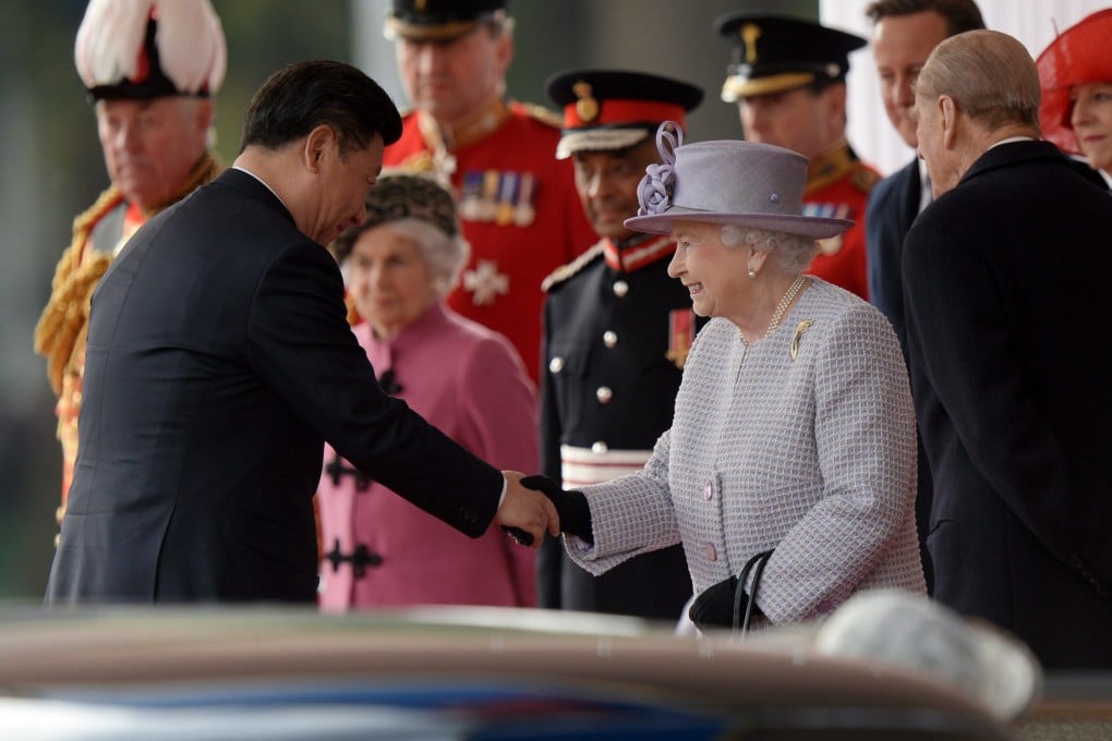 Chinese President Xi Jinping meets Britain's Queen Elizabeth II at Buckingham Palace in London on Tuesday. Photo: EPA