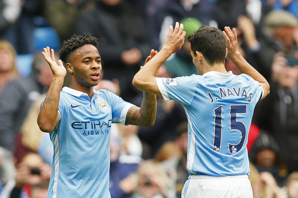 Raheem Sterling celebrates his hat trick with Jesus Navas. Photo: Reuters