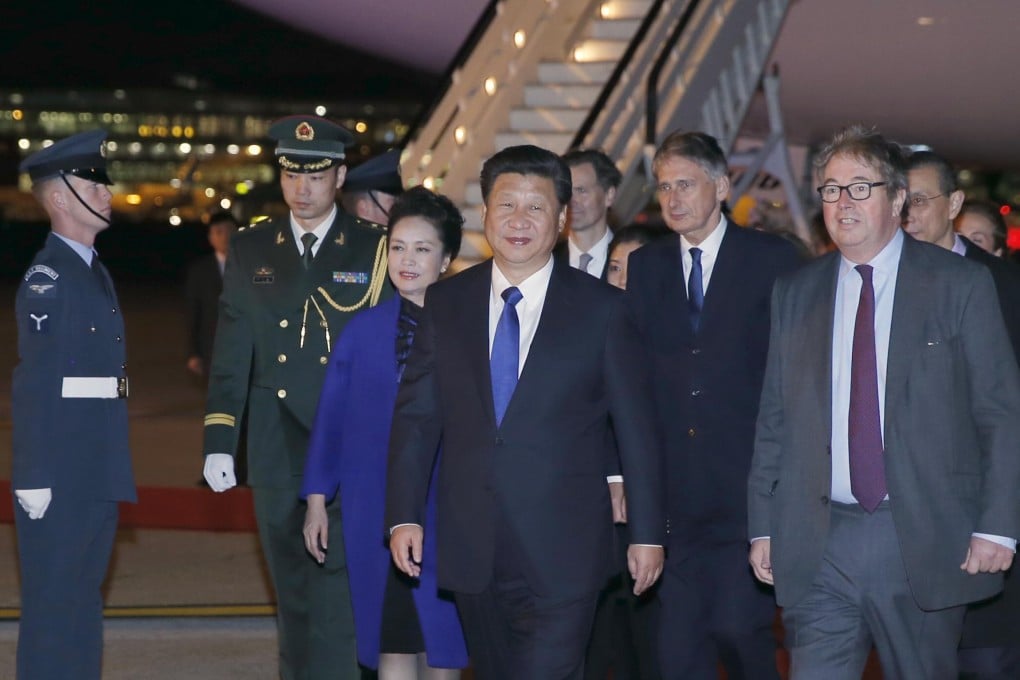 President Xi and his wife Peng Liyuan arriving at London's Heathrow Airport on Monday night. Photo: Reuters