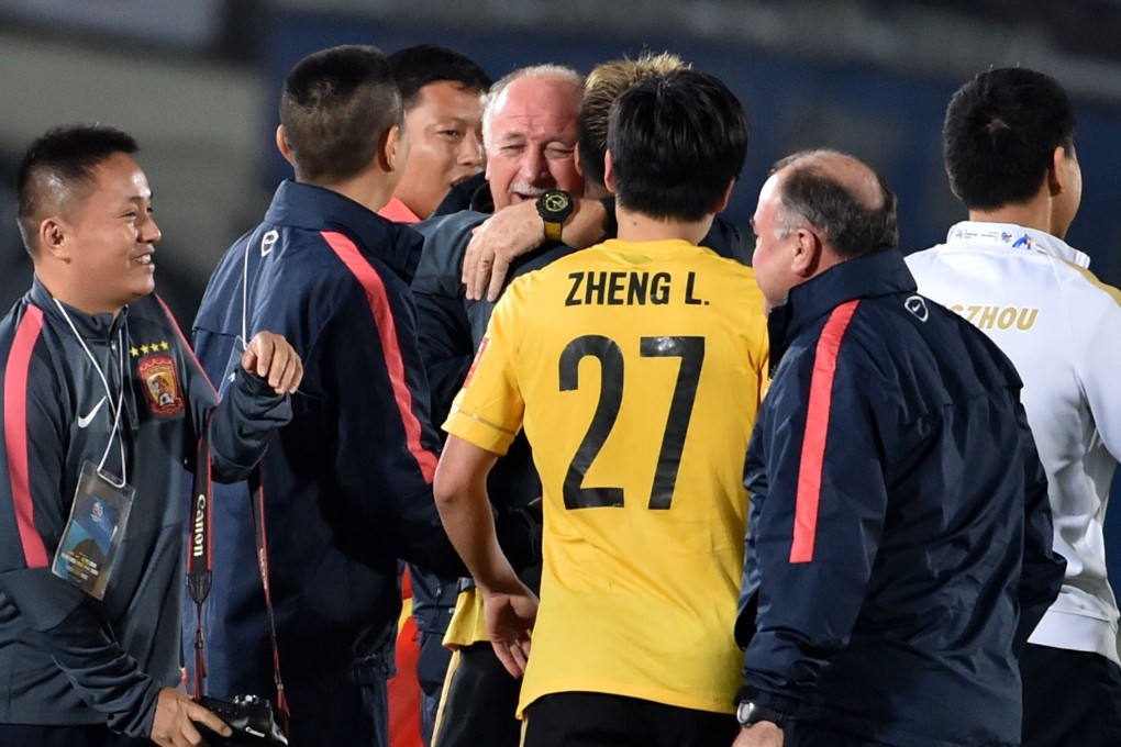Guangzhou Evergrande coach Luiz Felipe Scolari celebrates with his players in Osaka after reaching the AFC Champions League final. Photo: AFP