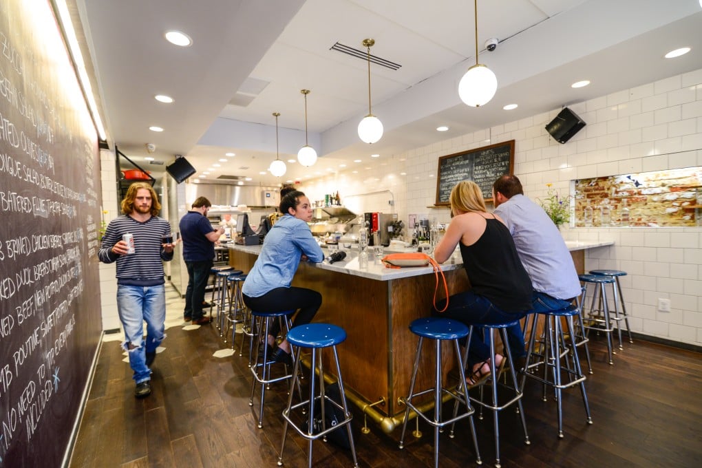 What would happen if service was paid for and added to the cost of food and drink? At a bar like Sally's Middle Name in Washington, D.C., well, it's not much different.