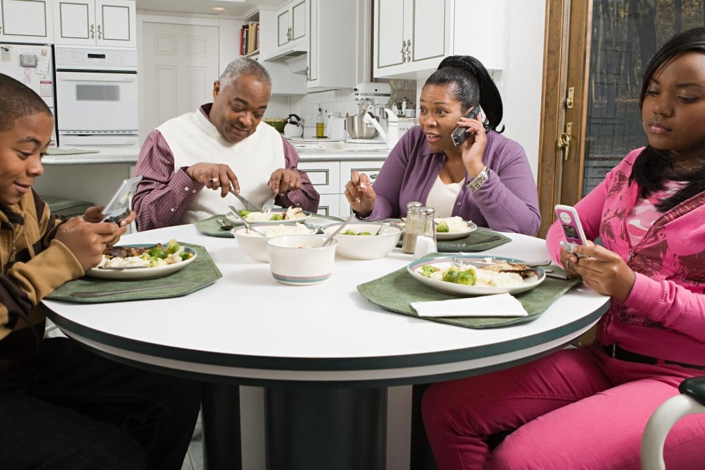 Many prefer to zone out with their mobile phones than talk to each other. Photo: Image Source/Corbis