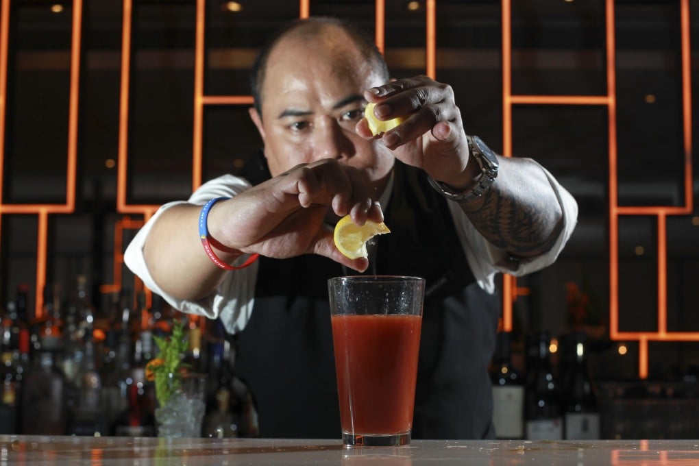 Armani Aqua bar supervisor Marlon Caparas makes a Bloody Mary. Photo: May Tse