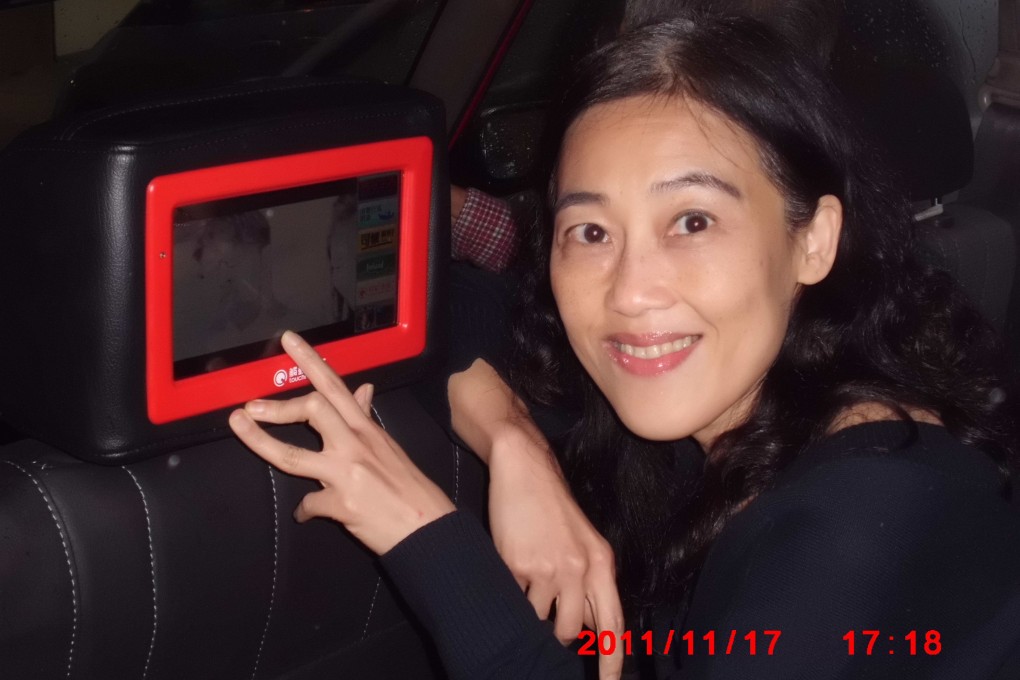 Maggie Choi of Touchmedia in a Hong Kong taxi