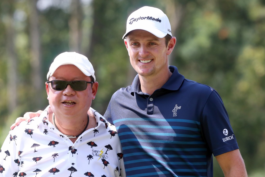 Hong Kong Tourism Board chairman Peter Lam Kin-ngok gets in on the act in a pose with English golfer Justin Rose on Wednesday ahead of the Hong Kong Open. Photos: K.Y. Cheng