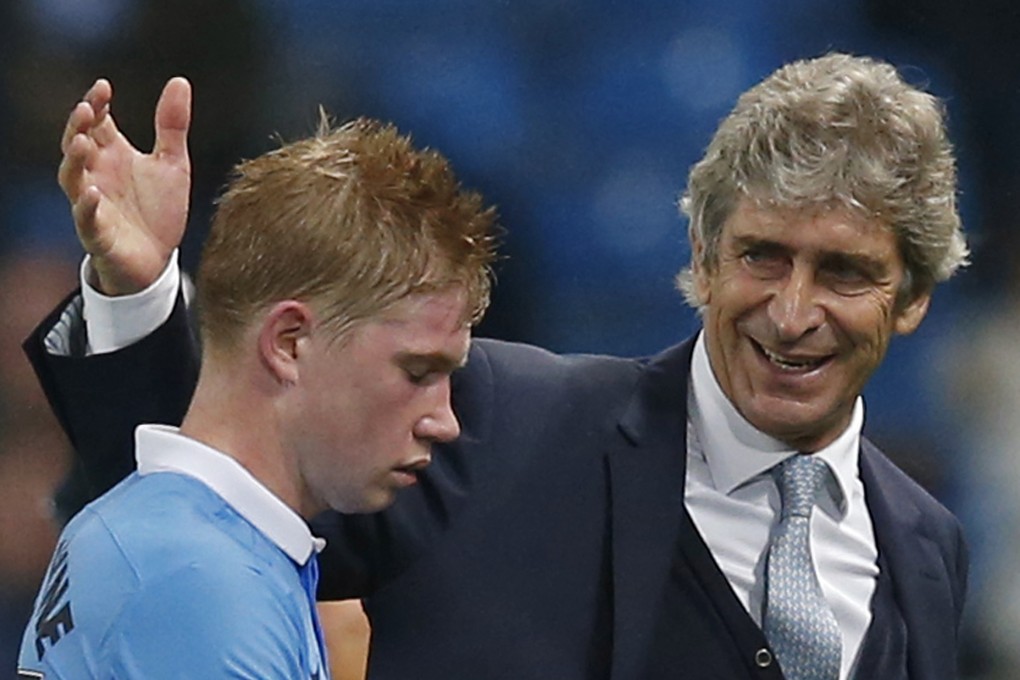 Kevin de Bruyne is congratulated by a beaming Manuel Pellegrini after the match. Photo: Reuters
