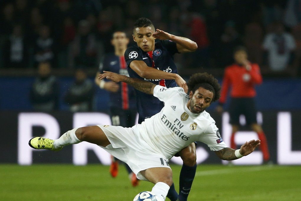 Real Madrid's Marcelo and  Paris Saint-Germain's Marquinhos vie for the ball. Photo: Reuters