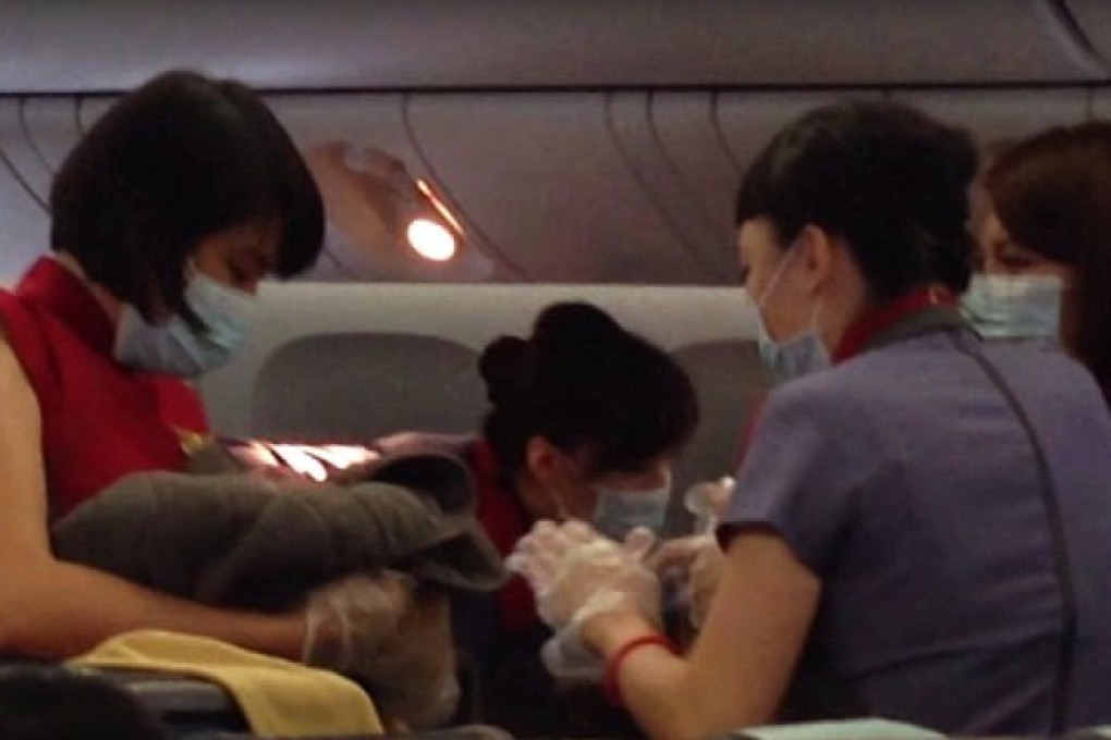 Crew working on board the China Airline airplane helped to deliver the baby girl on the morning of October 8. Photo: YouTube