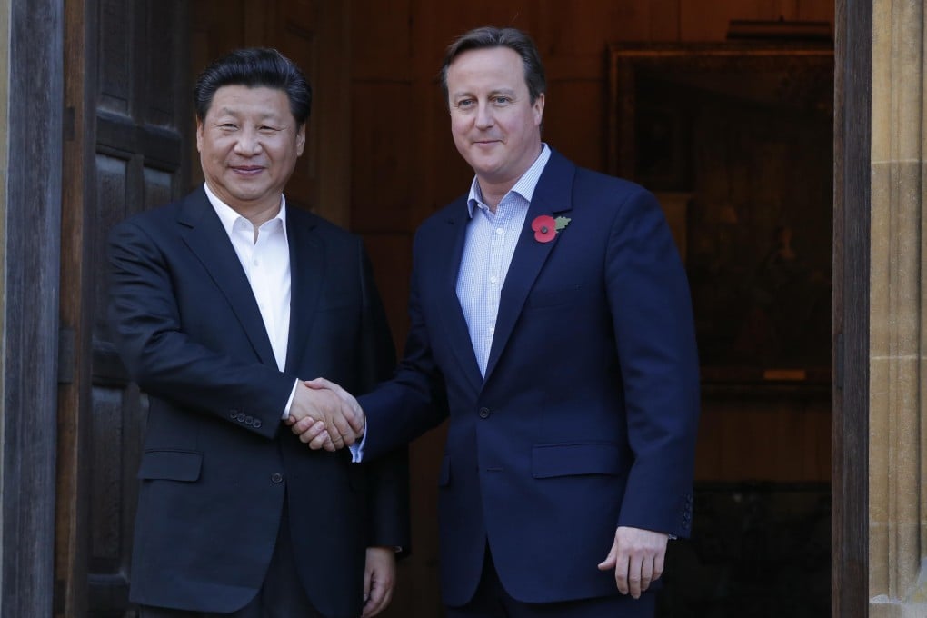 British Prime Minister David Cameron (right) greets China's President Xi Jinping at Chequers, his official country retreat, on Thursday. Photo: Xinhua