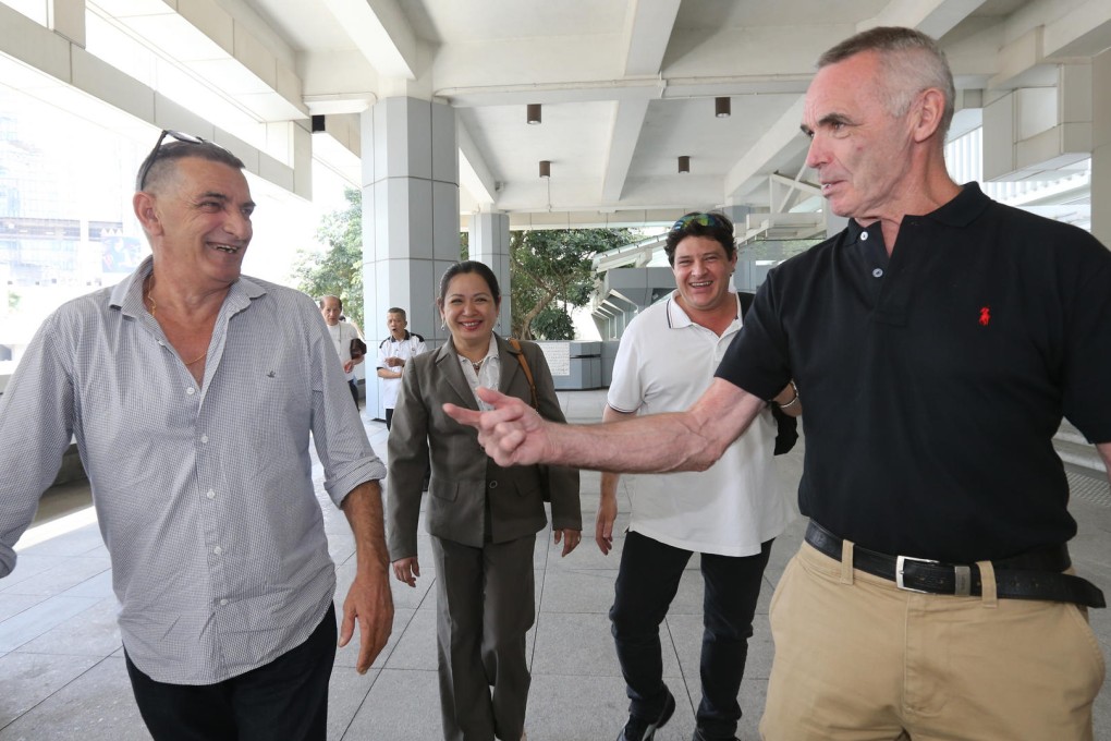 (From left) Defendants James Clifford, Luu Suong Thu, Kent Walsh and Brendan Toner outside the High Court yesterday. Photos: Dickson Lee