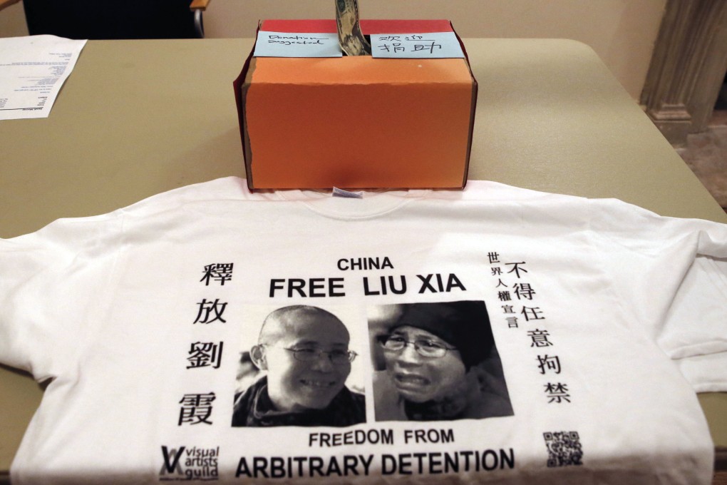 A supporter donates money at an event where Chinese and American writers pushed for the release from house arrest of Liu Xia, the detained wife of Chinese Nobel Peace laureate Liu Xiaobo, in New York. Photo: AP