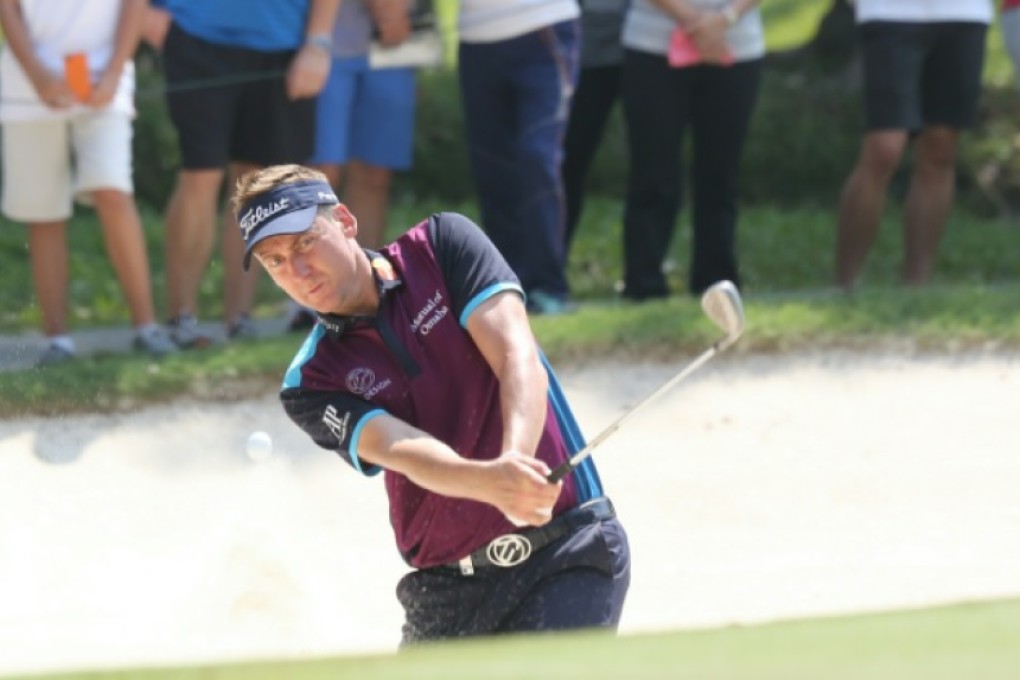 Ian Poulter hits of a bunker at Fanling. Photo: Edward Wong