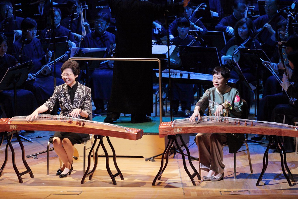 Chinese zithers such as the one Chief Secretary Carrie Lam (left) is playing would be banned on the MTR along with double basses, according to sources close to the review process. Photo: SCMP Pictures
