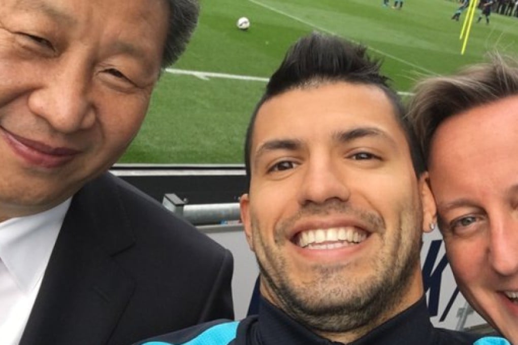 President Xi Jinping (left) and British Prime minister David Cameron pose for a selfie taken by Manchester City's striker Sergio Aguero. Photo: Manchester City