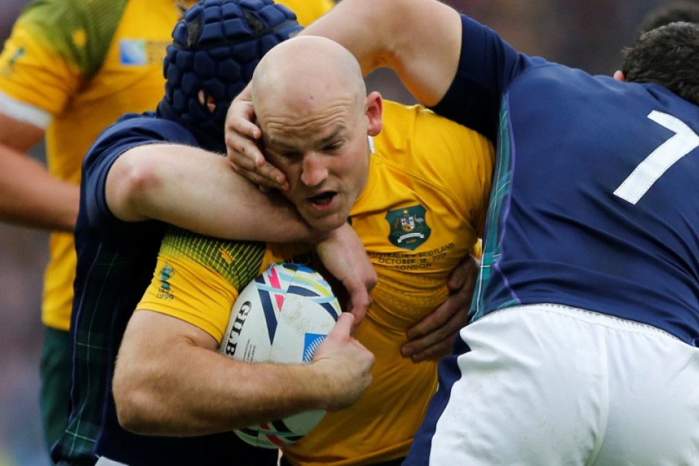 Wallabies skipper Stephen Moore is tackled by Scotland’s John Hardie during their World Cup quarter-final match at Twickenham last Sunday. Photo: AP