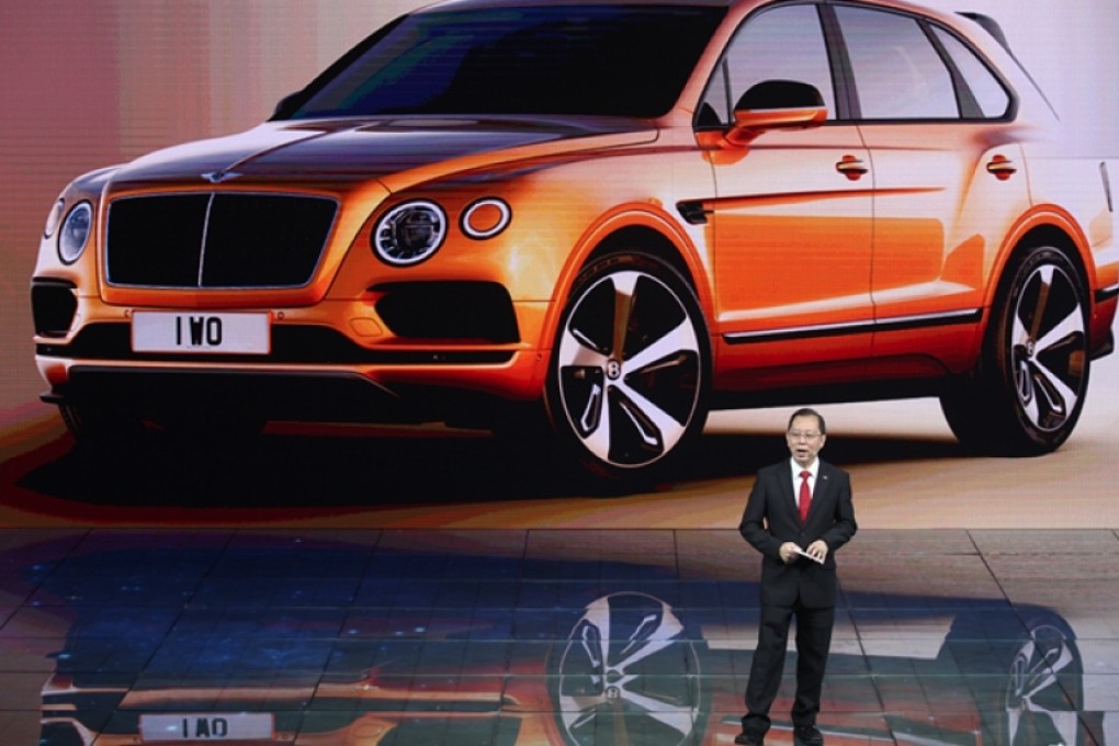 Ricky Tay shows off the Bentayga, the luxury marque's first foray into the SUV market, in Chengdu, southern China. Photo: SCMP Pictures