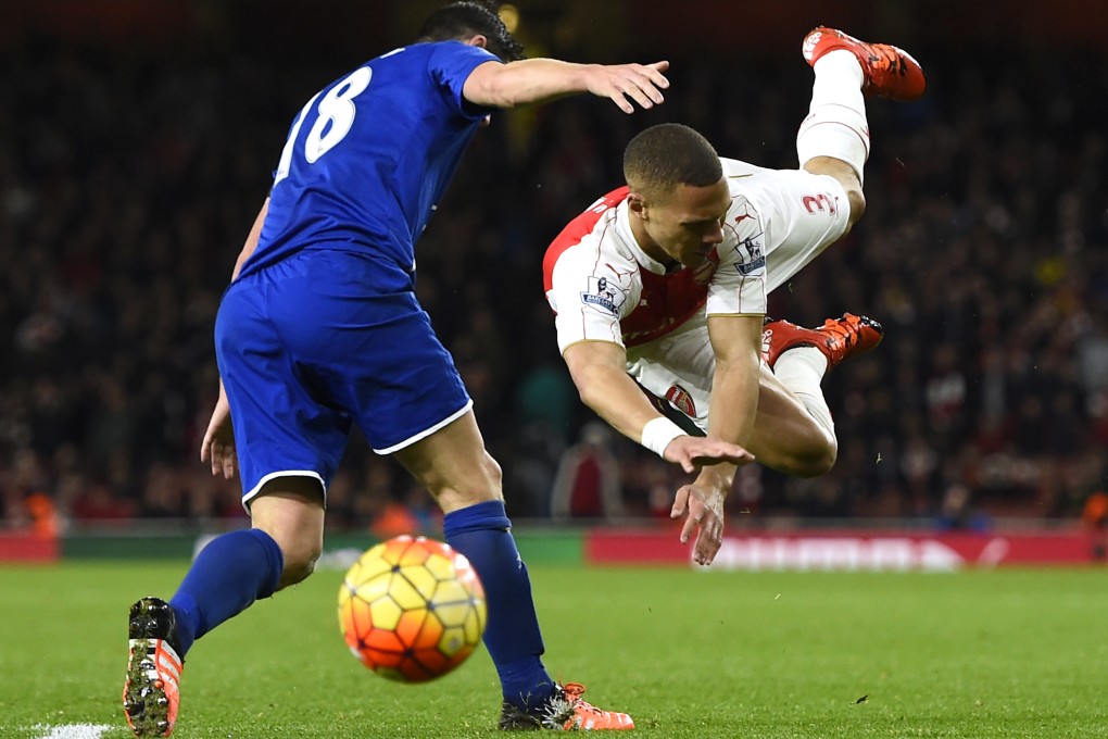 Everton's Gareth Barry fouls Arsenal's Kieran Gibbs resulting in a second yellow card and being sent off. Photo: Reuters