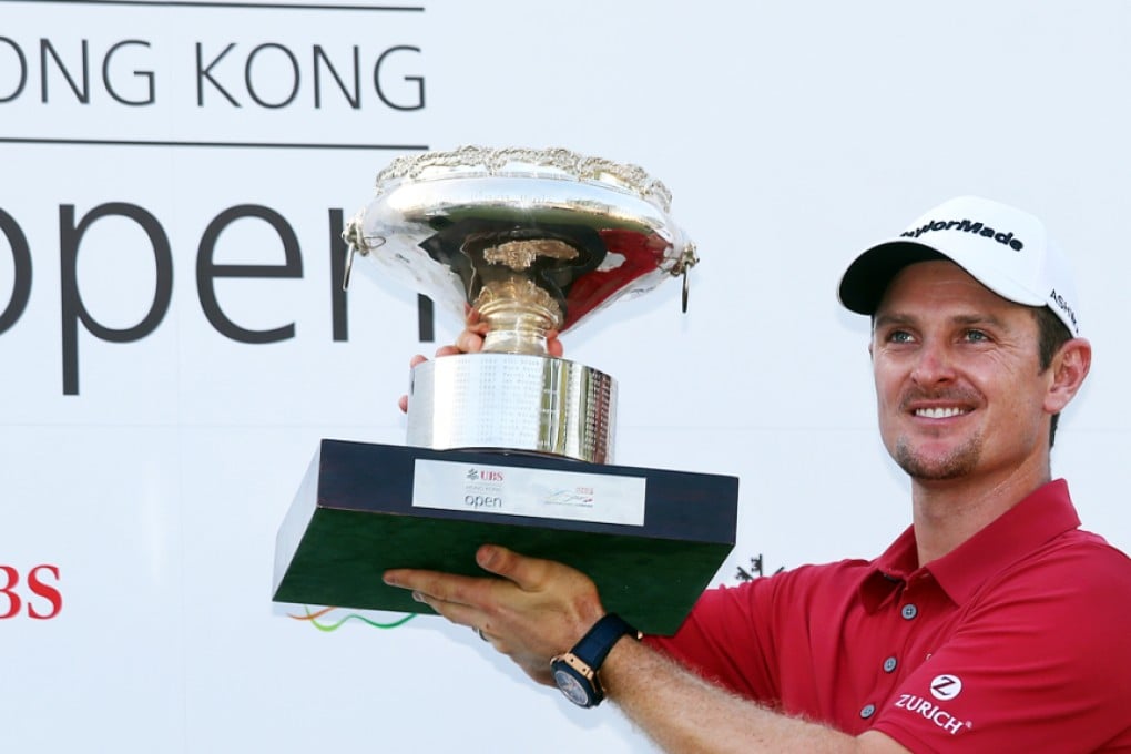 Justin Rose of England celebrates with the championship trophy after the final round of the Hong Kong Open at the Hong Kong Golf Club. Photos: K.Y. Cheng