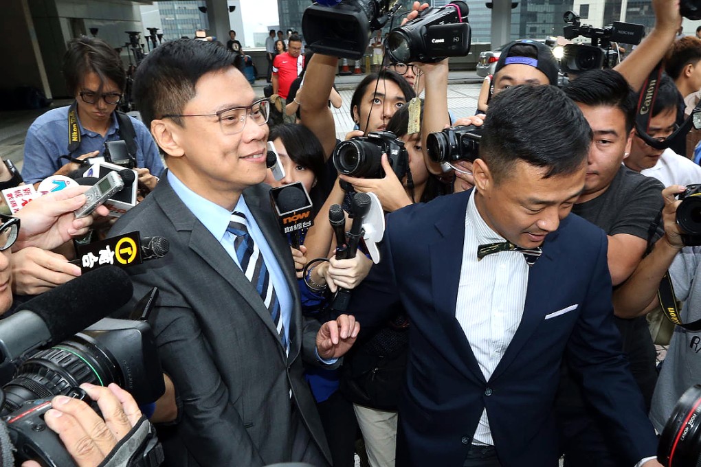 Stephen Chan (left), seen here leaving court on Monday with actor and singer Wong He, was found guilty of one count of agents conspiring to accept advantages. Photo: Felix Wong