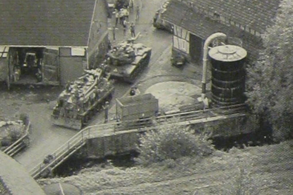 NATO armoured vehicles move through a village during the 1983 war games that had Moscow convinced the US was poised to launch a nuclear attack on the Soviet Union. Photo: National Security Archive