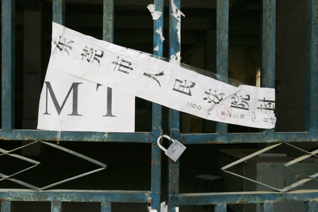 A court seal is taped to a closed toy factory in Dongguan in 2009. About 500 factories have closed this year. Photo: AP