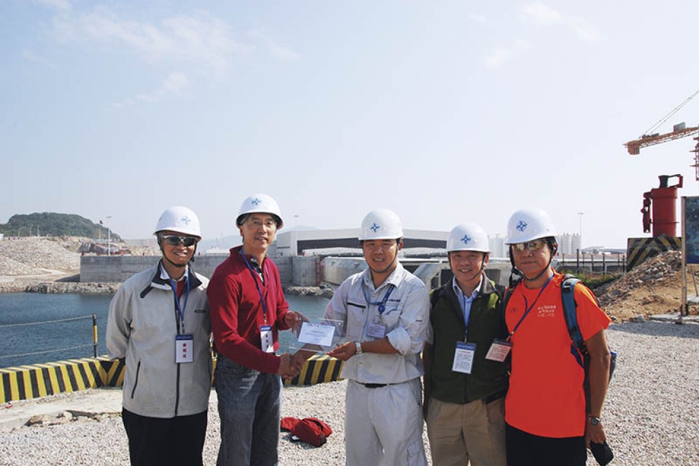 Representatives of China Communications Construction Company are shown at work on a project in this file photo. The company has signed an MOU with the state of Jaliscoon on what will stand as one of the biggest Chinese investments in Mexico to date. Photo: Handout