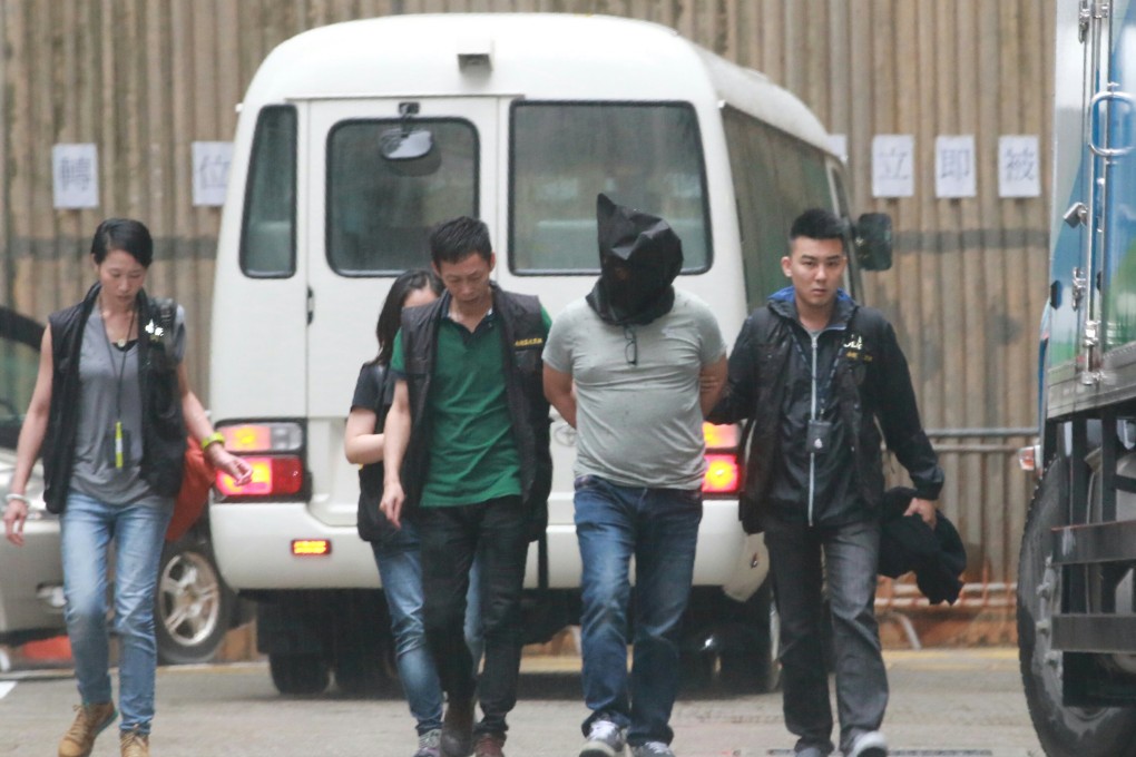In this file photo, an alleged triad member is arrested earlier this year in Hong Kong. Photo: Handout