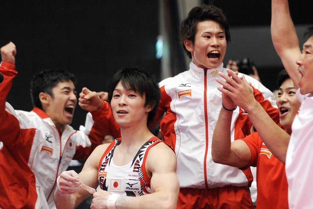 Japan celebrate their win. Photo: AFP