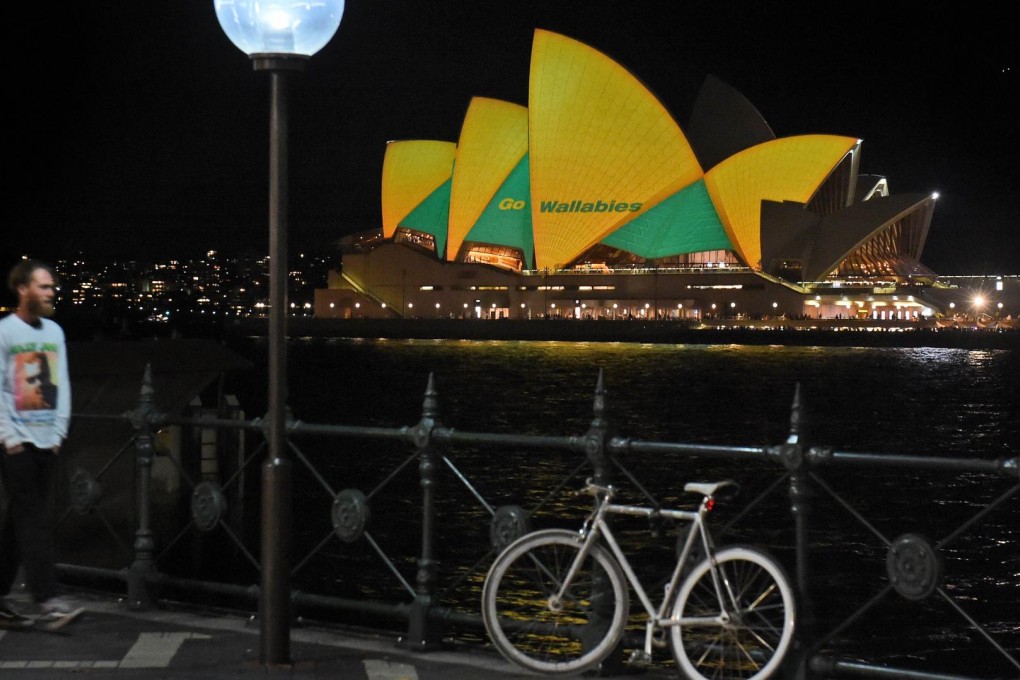 The Sydney Opera House is lit up in the colours of the Wallabies in the countdown to the Rugby World Cup final at Twickenham. Photo: AFP