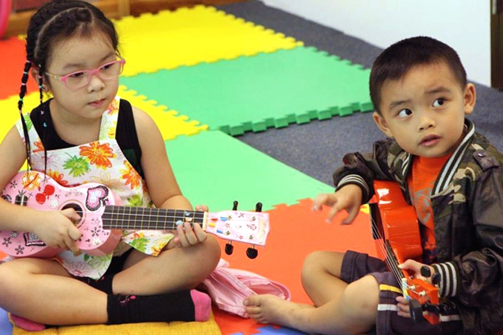 These Hong Kong youngsters show they can handle a ukelele. Photo: Bernice Chan