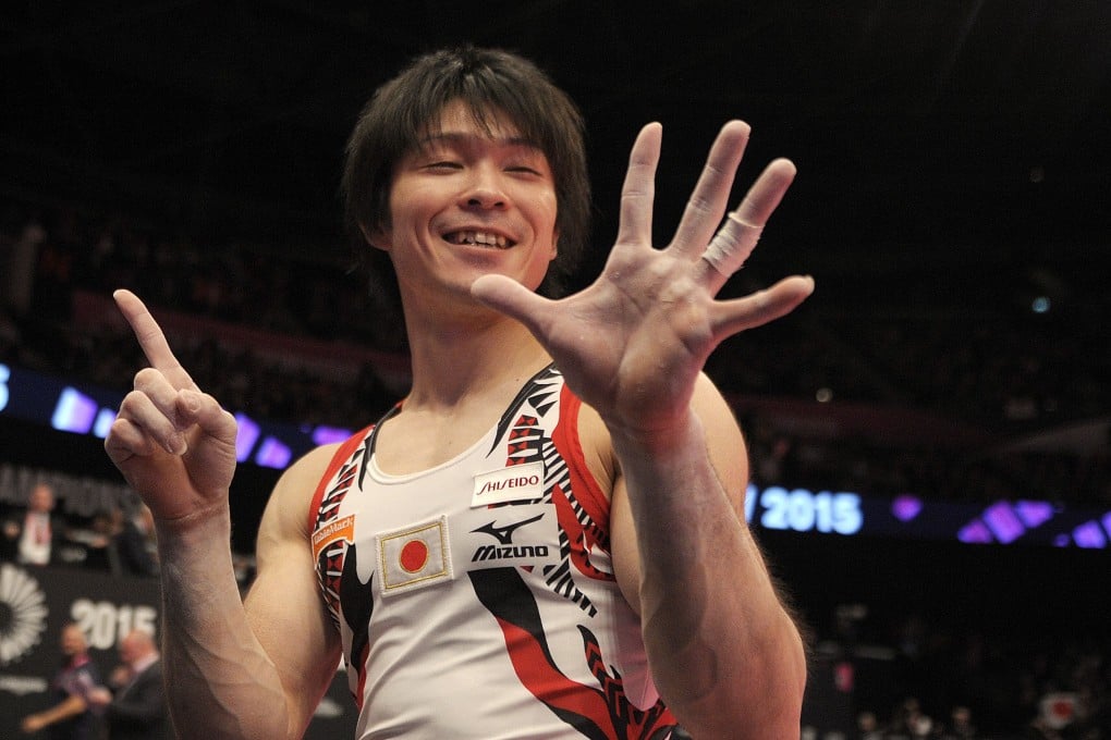 Kohei Uchimura signals 6. Photo: AFP