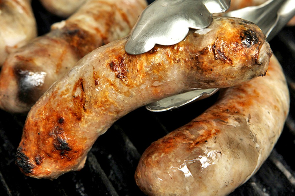 Sausage on a grill. Will you be cutting down on sausage, ham and bacon because of the WHO finding? Photo: Edward Wong
